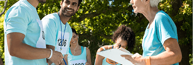 Charity runners wearing numbered bibs